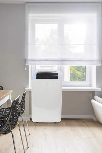 fully self evaporating portable air conditioner with heat